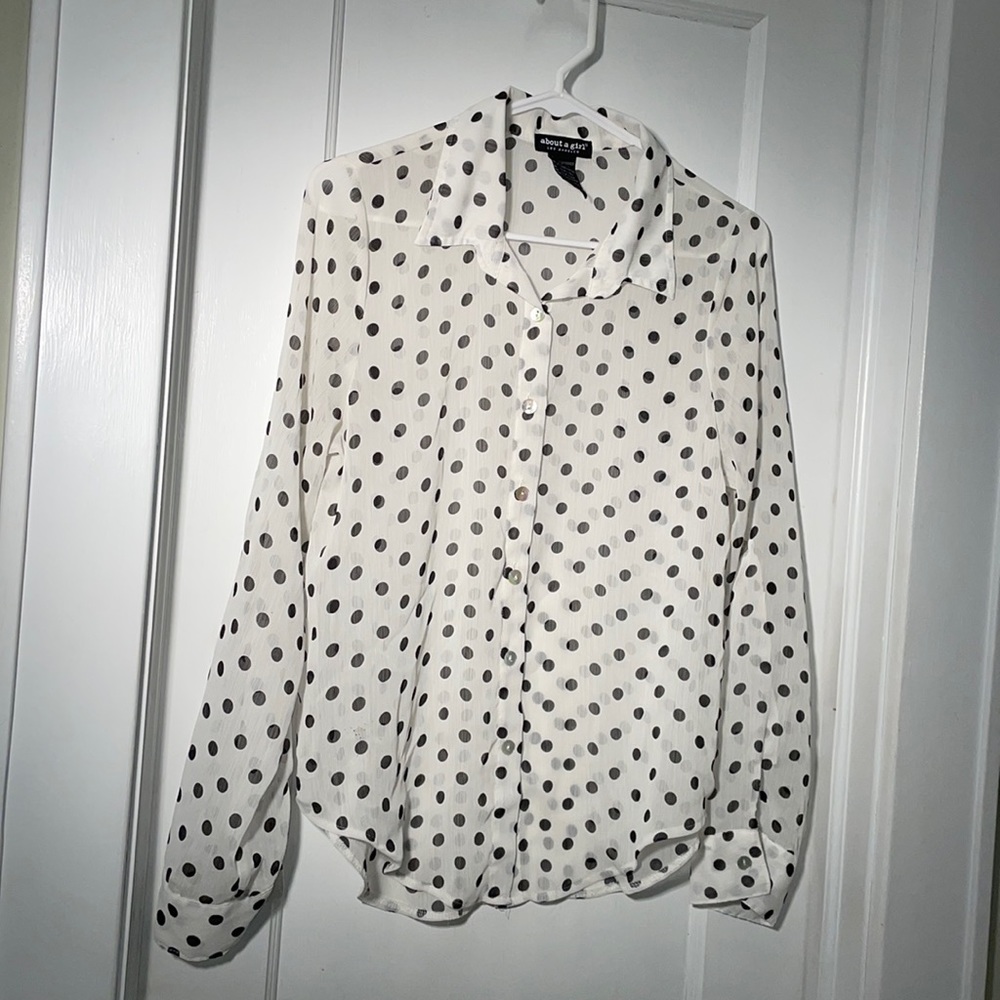 About a girl Los Angeles white see through black polka dot blouse size medium.